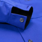 Cuff of the oversized royal blue jacket in recycled cotton